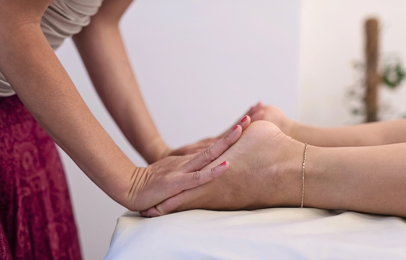 Reflexologist preparing for a session